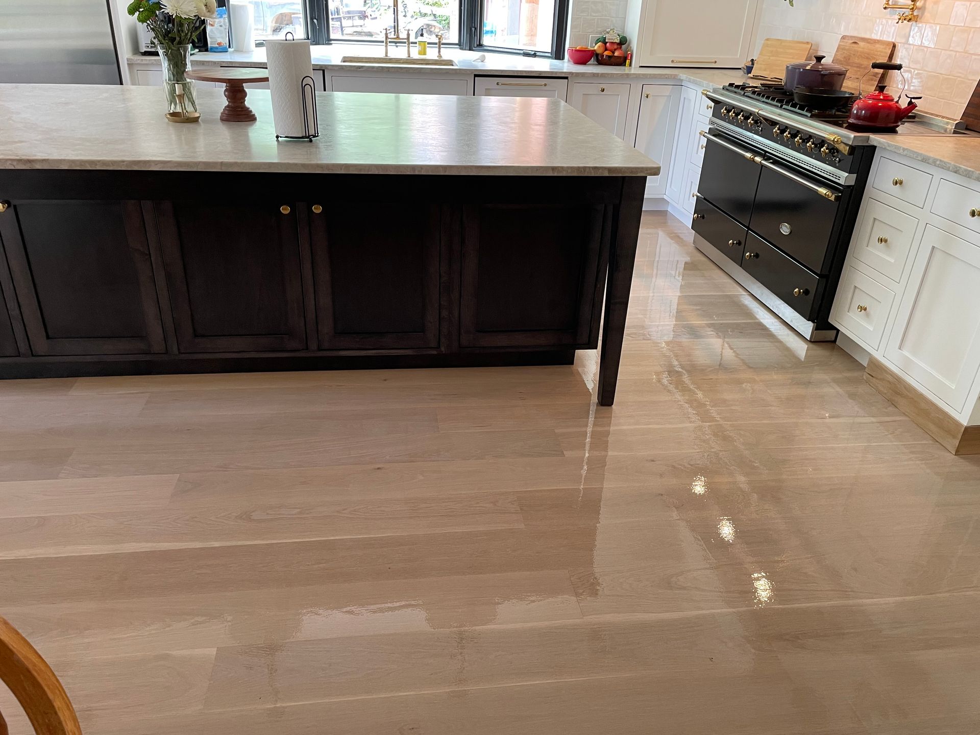 A kitchen with a large island in the middle of it.