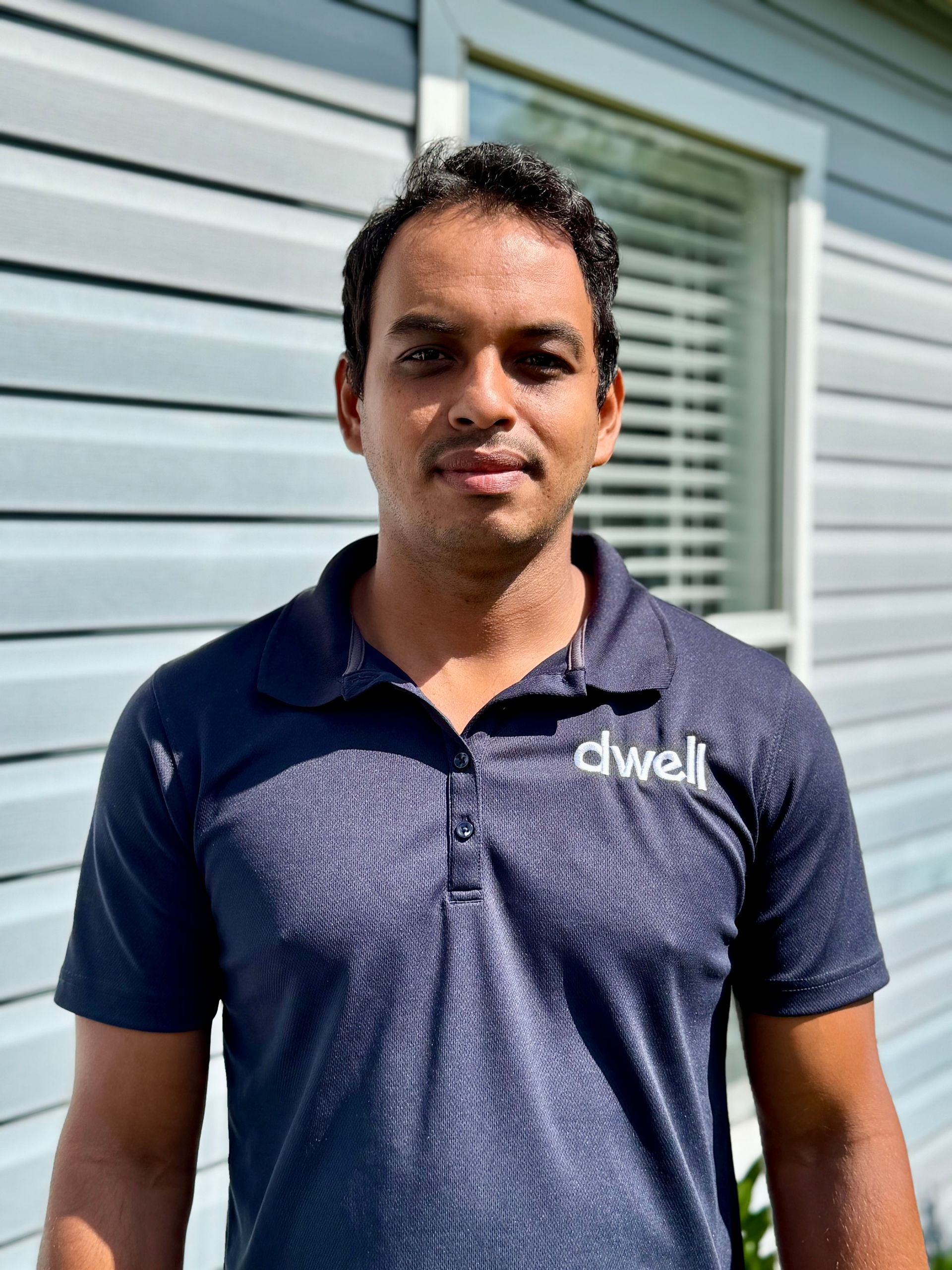 A coming soon sign with a camera in a circle on a white background.