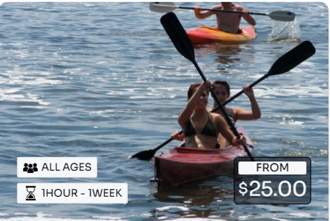 A woman is paddling a red kayak on a lake.