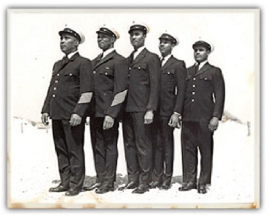 A black and white photo of a group of men in uniform