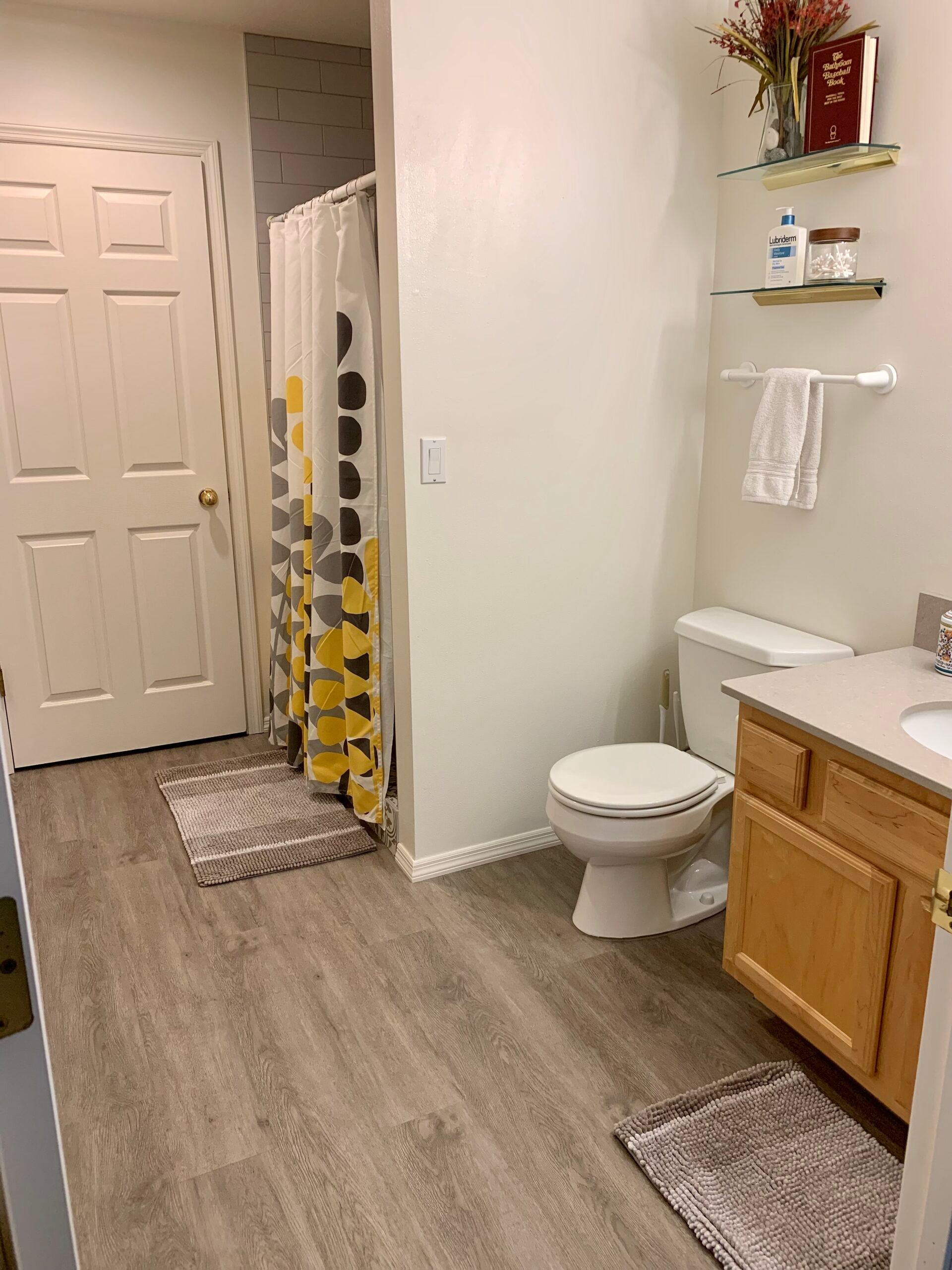 A bathroom with a shower , sink , and shower curtain. Best place to stay in Bozeman, MT. Yellowstone National Park, Montana State University, MSU parents, graduations, events. 