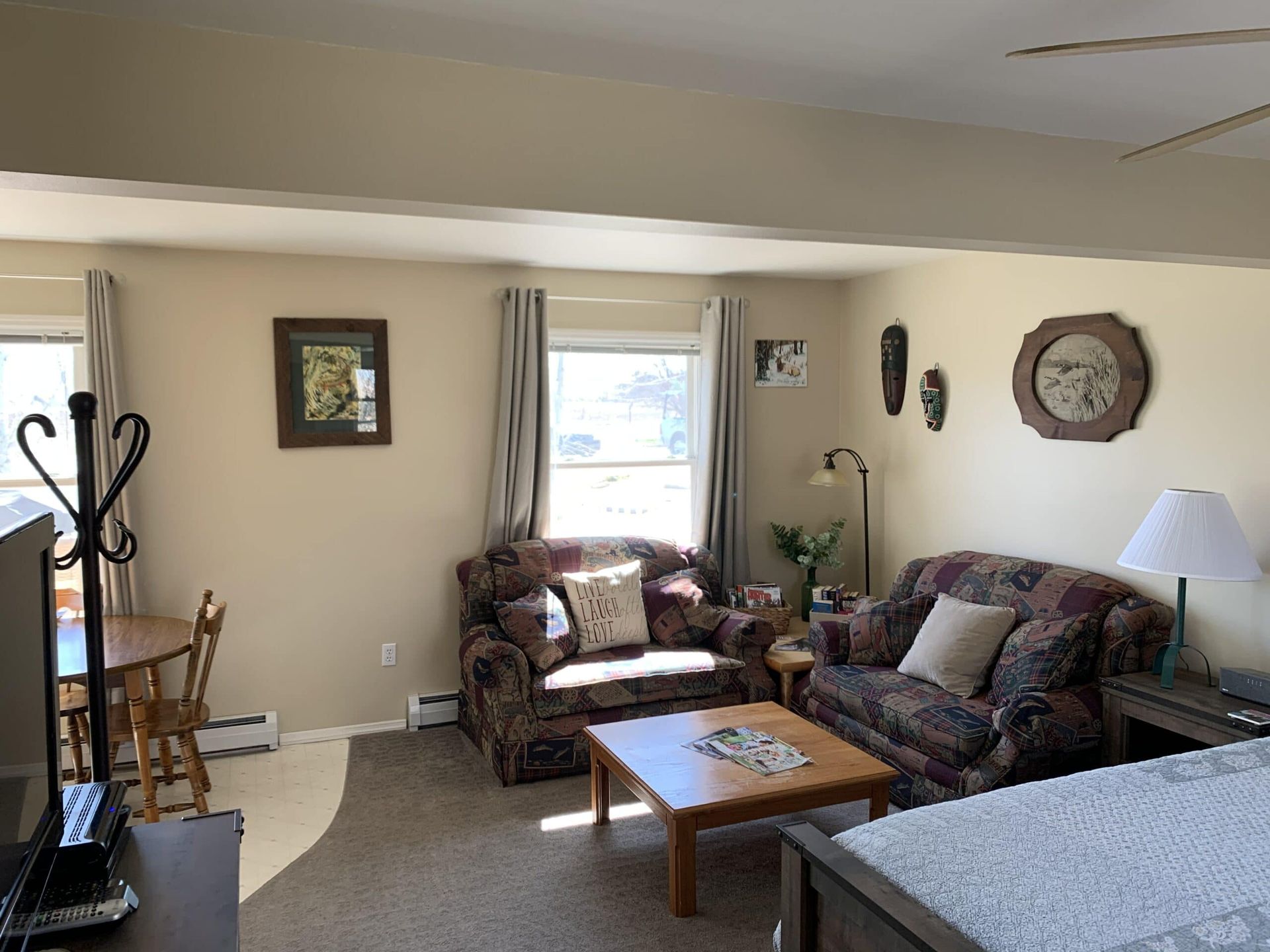 A living room with a couch , chair and table