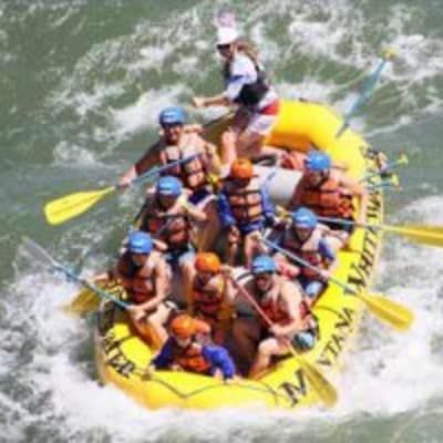 A group of people are rafting down a river.