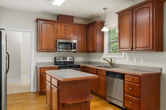 Complete kitchen setup with appliances and storage solutions