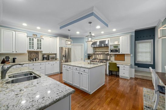 A microwave near a sliding door, patio, and mobile home.