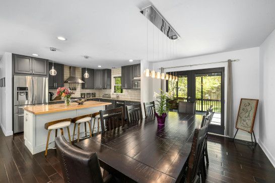 A restaurant dining table with a sliding door and patio nearby.