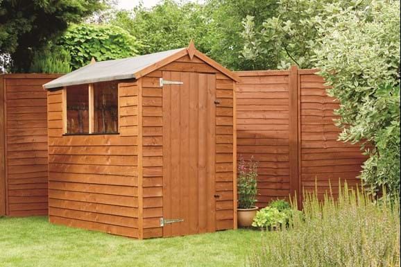 Brown painted shed in Newport Wales. Expertly painted by Orchid Decor.