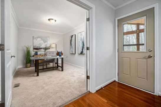 A sliding door with a shoji design, bookcase, and china cabinet.