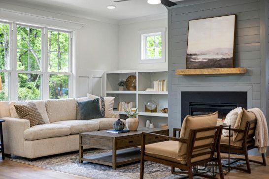 A window shade with a sliding door, patio, and bookcase.