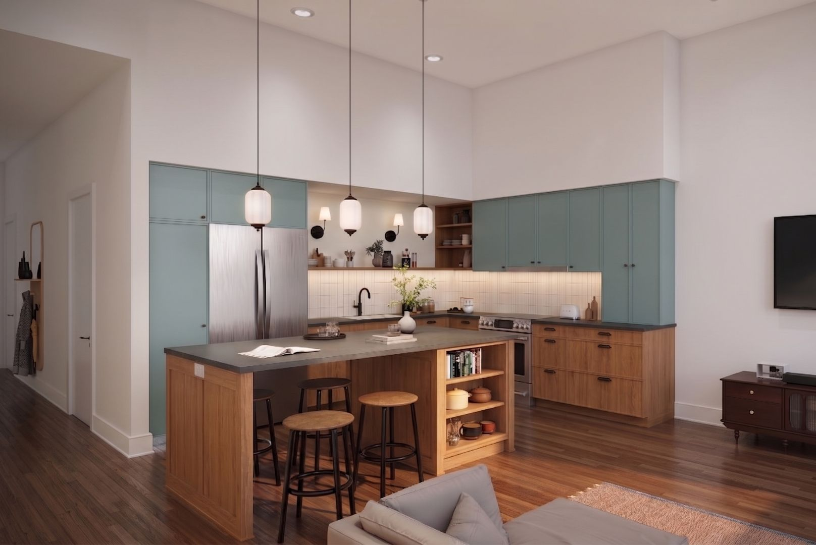 Modern kitchen with light blue cabinets, wooden island, pendant lights, and hardwood floors.