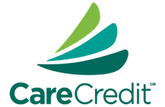 The logo for carecredit shows a green sailboat on a white background.