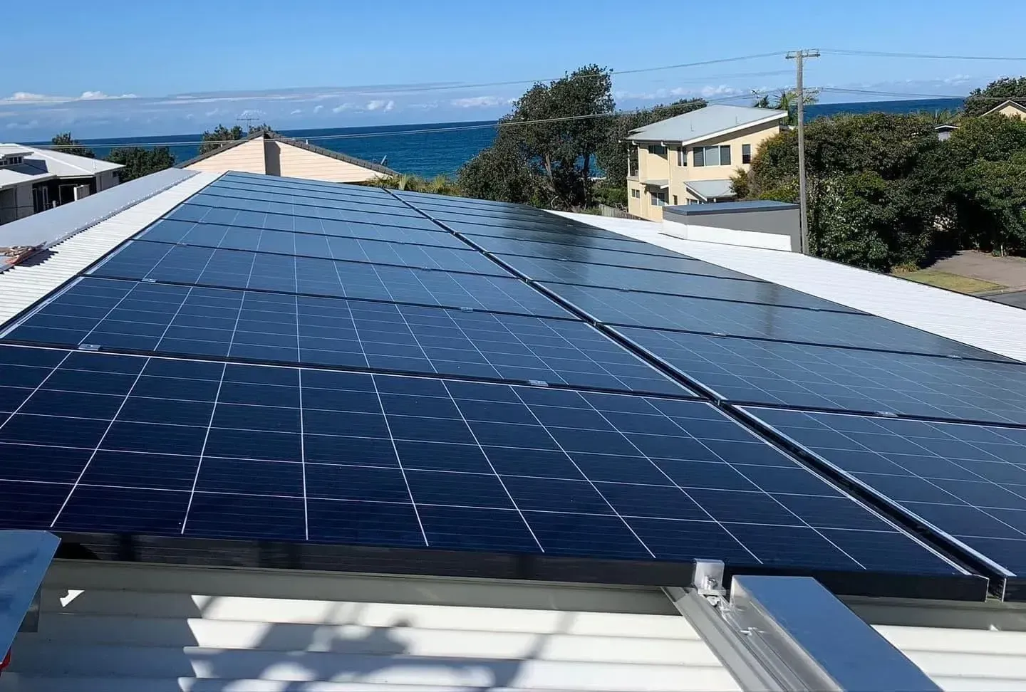 Solar Panels Installed on a Residential Roof Overlooking the Ocean — Forster Solar and Lighting In Forster, NSW