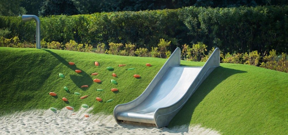Playground Features a Slide Embedded in a Grassy Hill — Banksia Turf In Lake Cathie, NSW