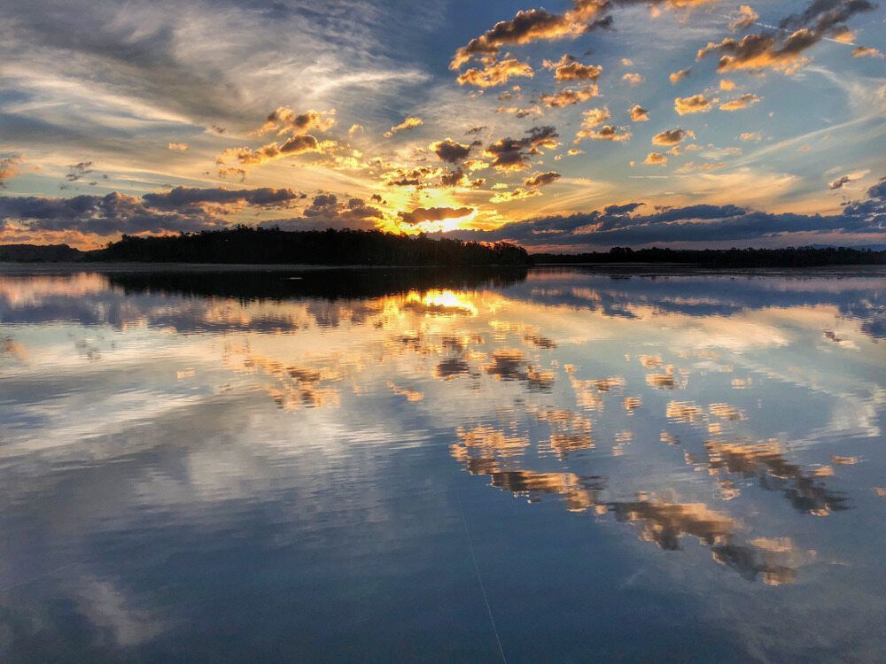 Serene Sunset Over a Calm Lake — Banksia Turf In Old Bar, NSW
