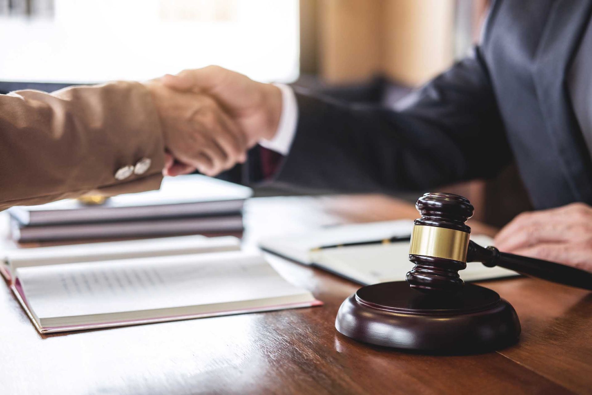 Lawyer shaking hands with client — Lakeland, FL — Kaylor Law Group