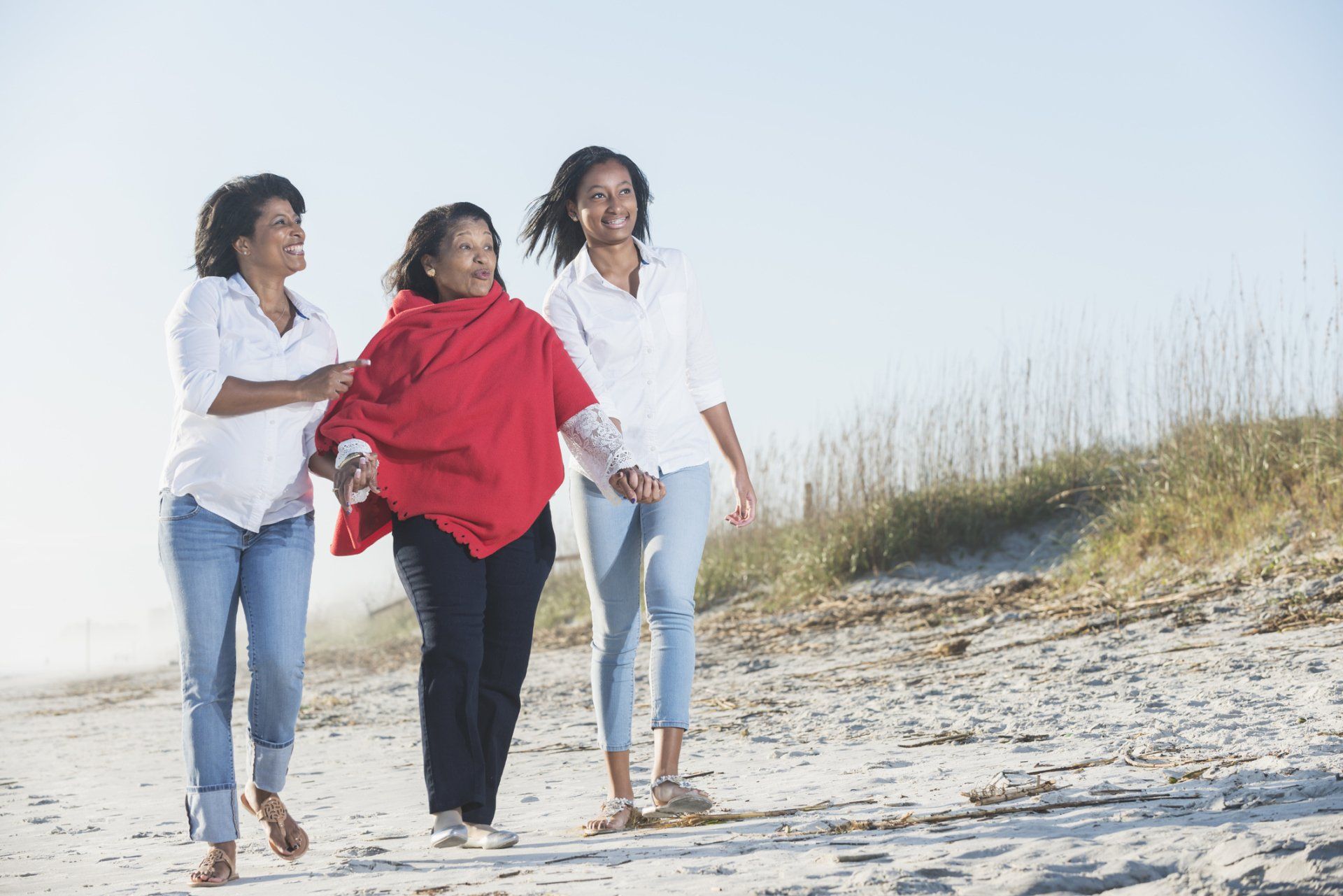 Family walking down the beach.