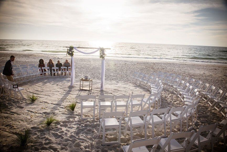 Wedding altar with chairs surrounding.