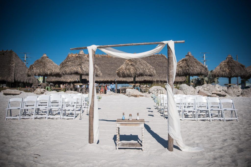 Wedding altar with large beach tiki behind