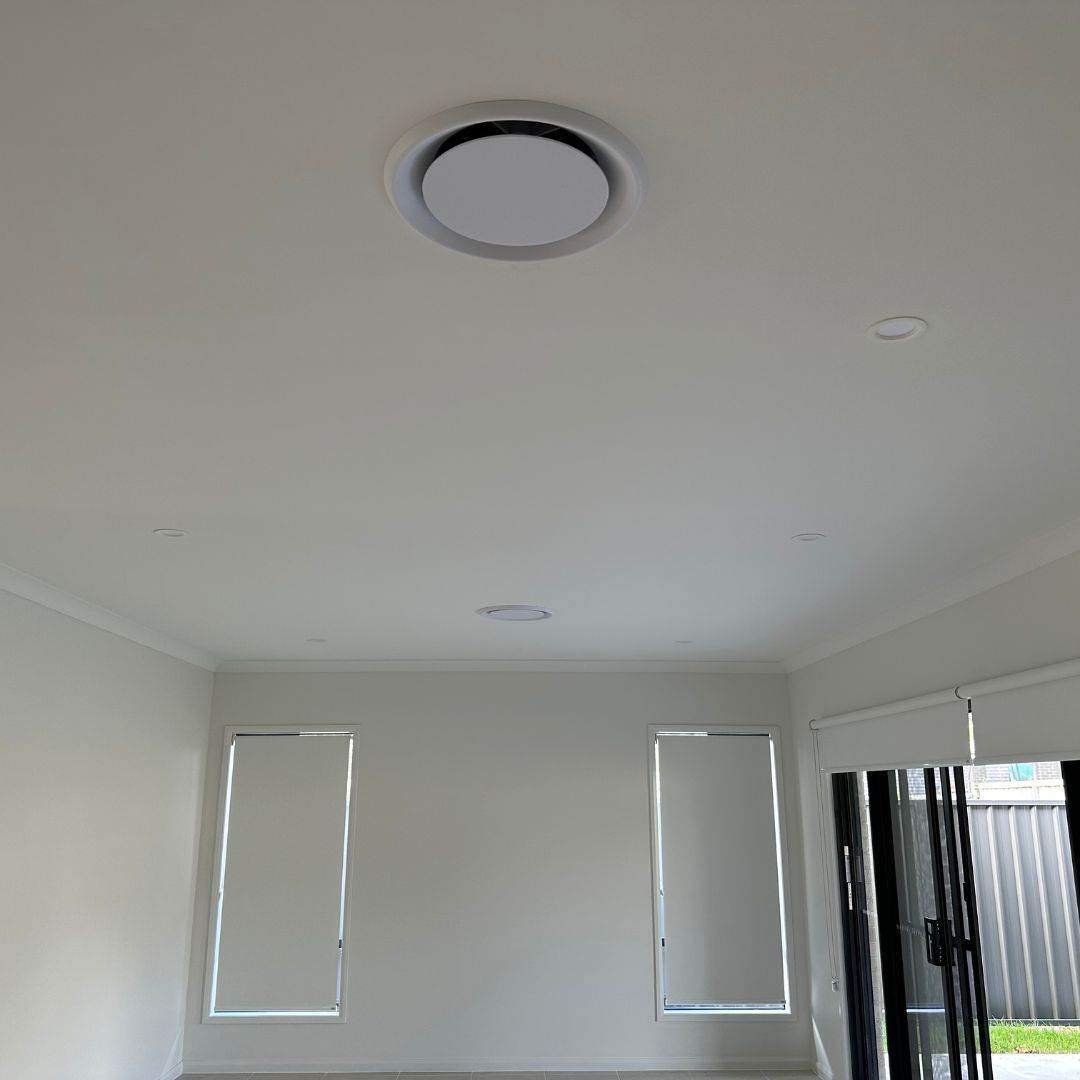 Ducted air conditioning vents installed on a ceiling by Lakeside Air & Electrical.
