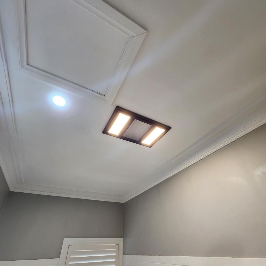 A bathroom exhaust fan and IXL installed by Lakeside Air & Electrical.