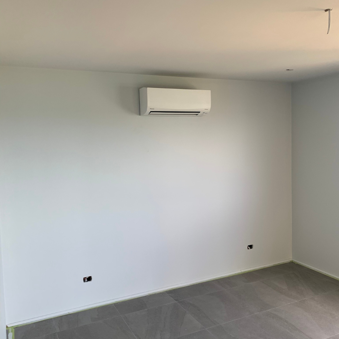 A Daikin split system air conditioner installed in a bedroom by Lakeside Air & Electrical.