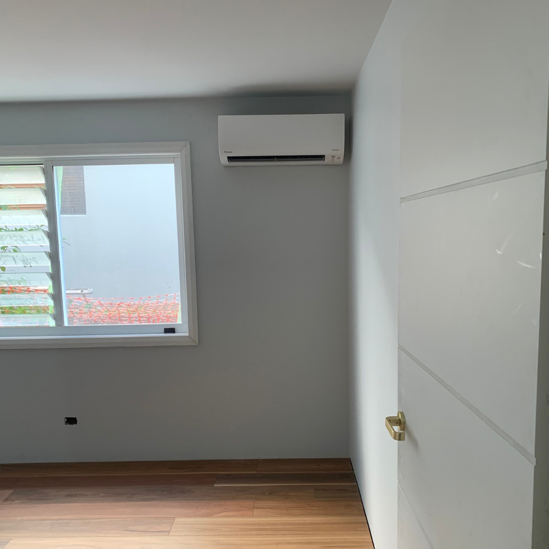 A Daikin split system air conditioning unit installed on a wall by Lakeside Air & Electrical.