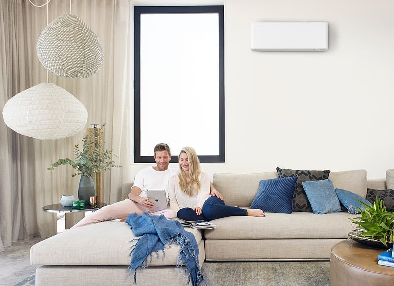 Daikin Zena air conditioning unit installed on a lounge room wall.