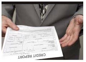 man holding credit report form