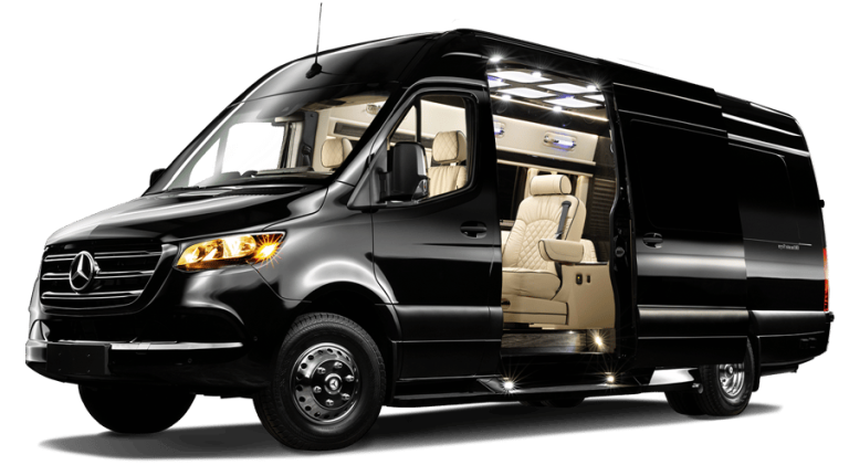 Black luxury van with open sliding door; tan interior, parked outdoors.