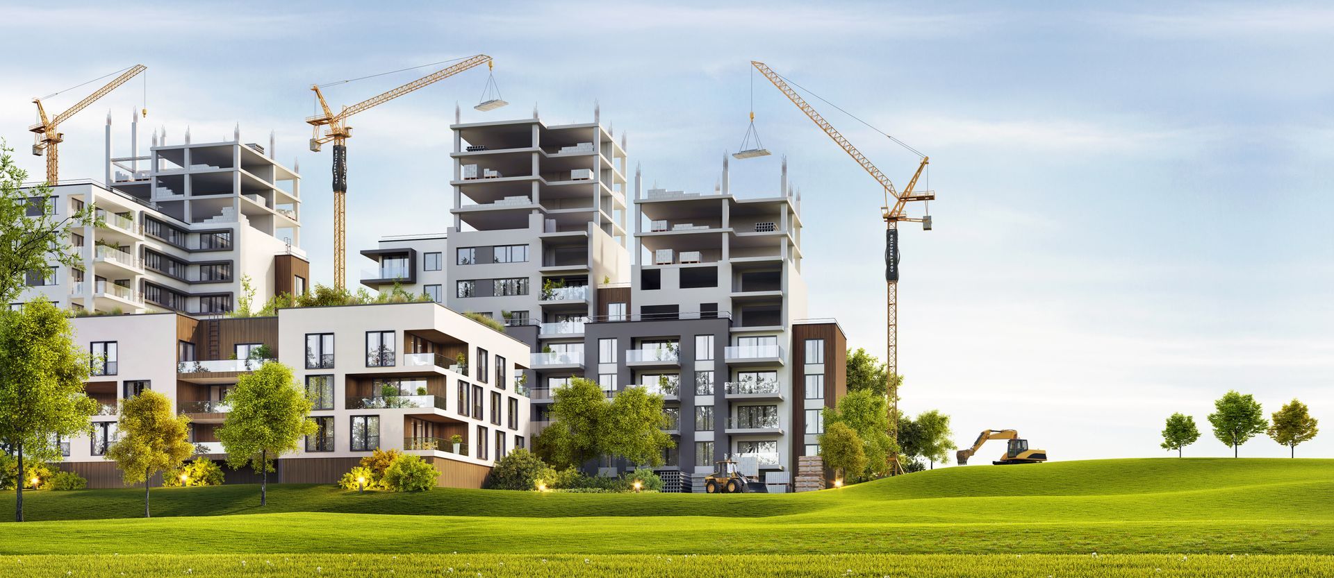 Un groupe de bâtiments est en cours de construction dans un champ vert.