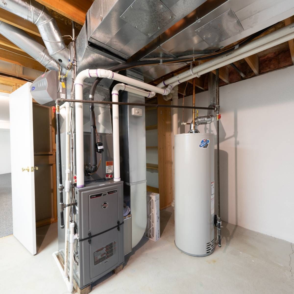 Basement with furnace and water heater; ductwork and pipes visible.