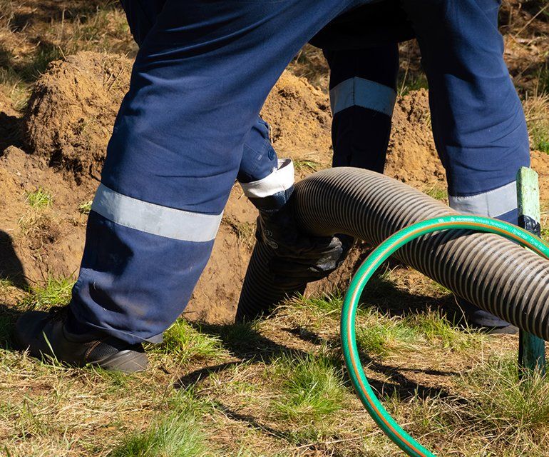 Man Providing Sewer Cleaning Service — Chelan, WA — Jim’s Pumping Services, Inc.