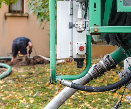 Worker Cleaning The Septic Tank — Chelan, WA — Jim’s Pumping Services, Inc.