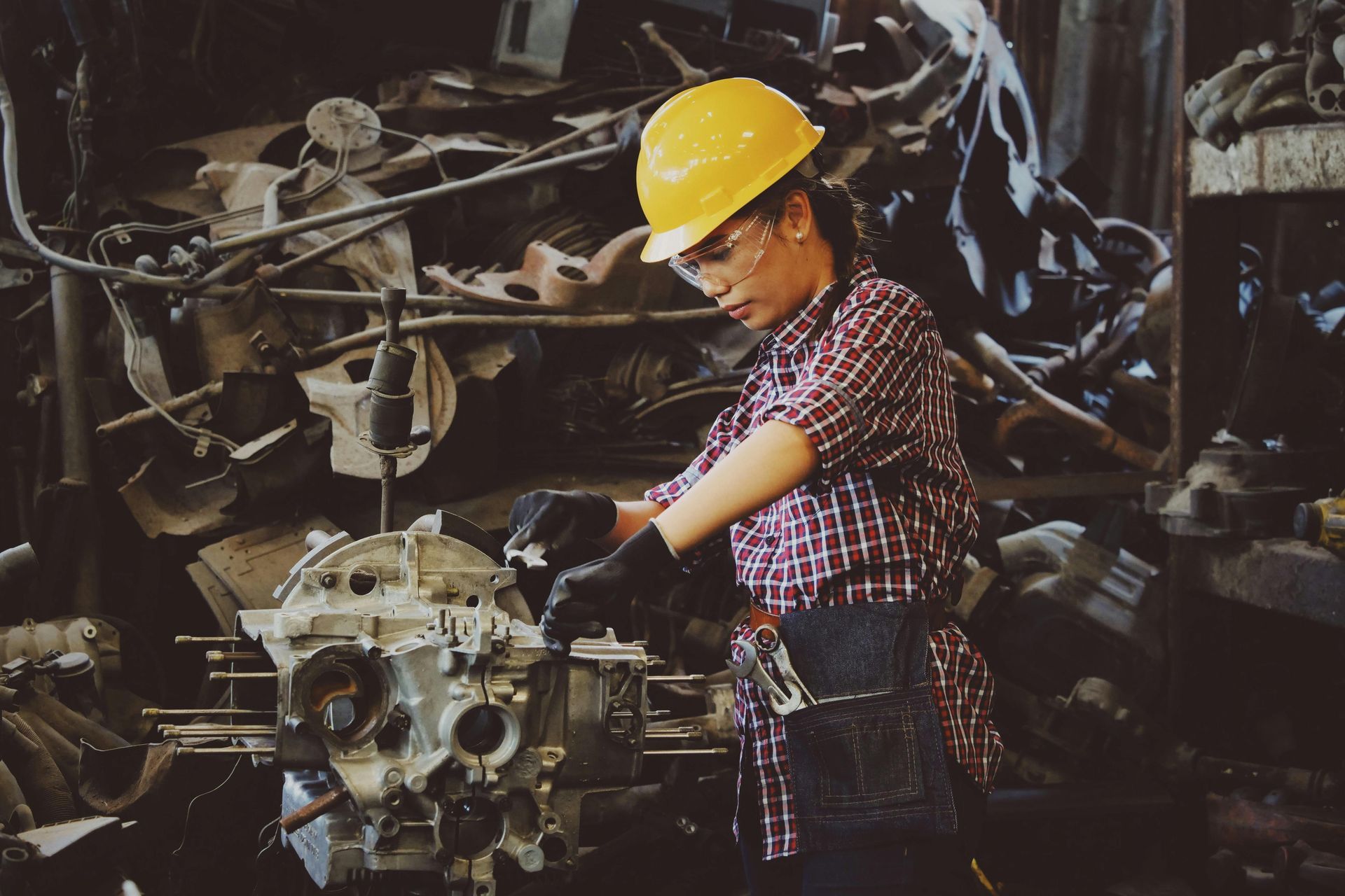 woman working on machinery