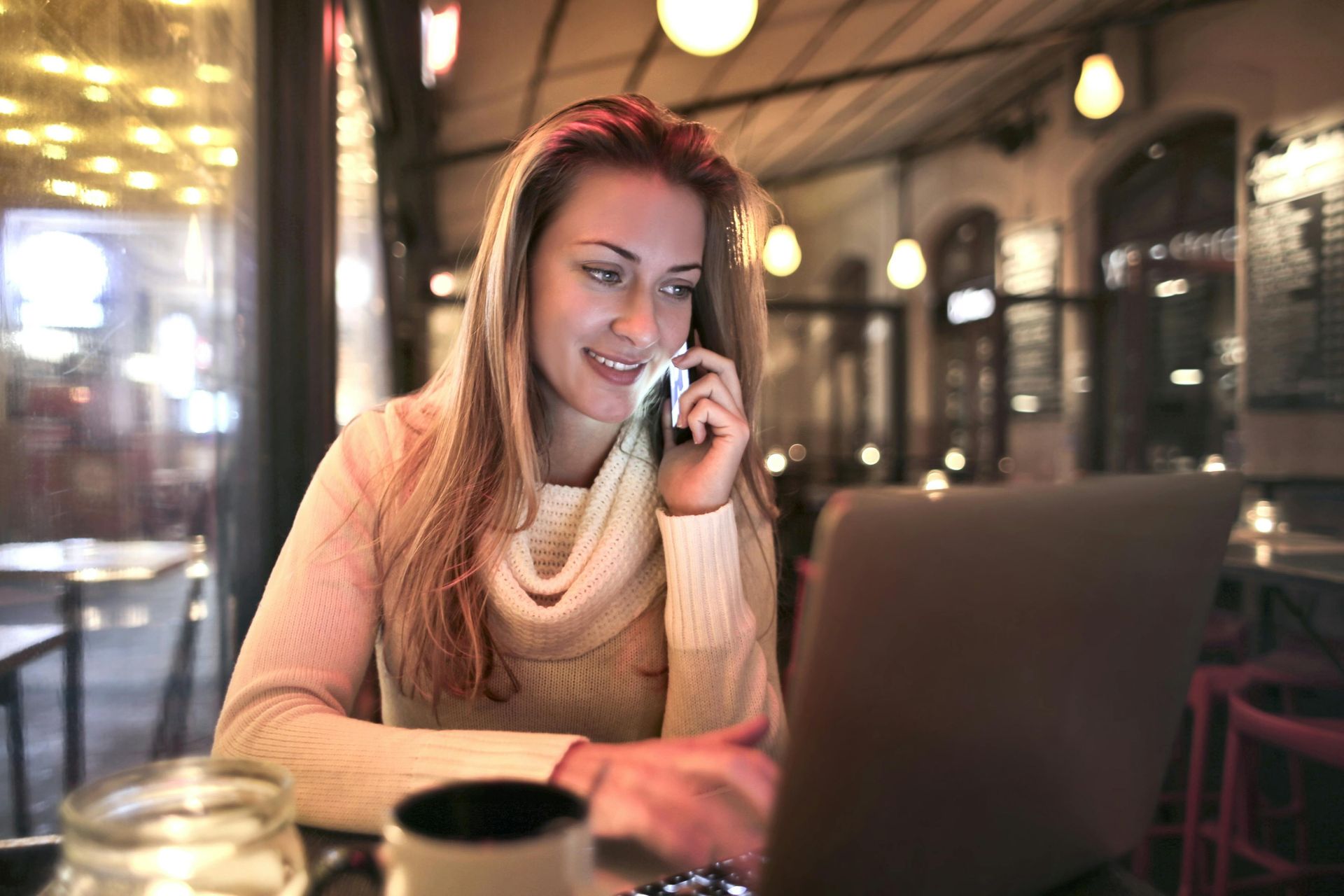 image of woman on the phone and her computer