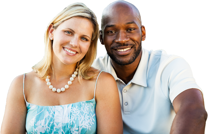 A man and a woman are posing for a picture and smiling for the camera.