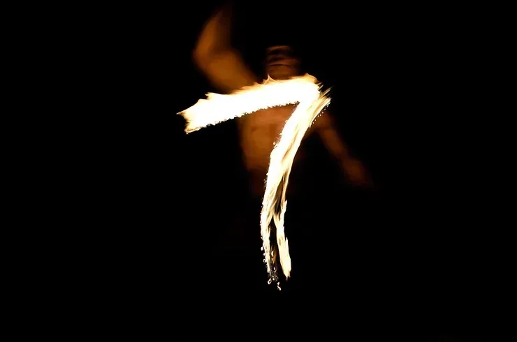 The number 7 is illuminated in the darkness