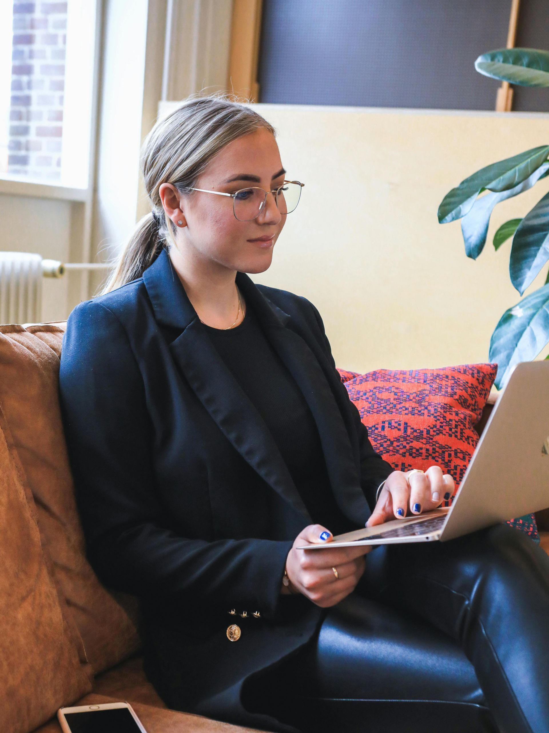 A woman is holding a tray of plants in her hands.