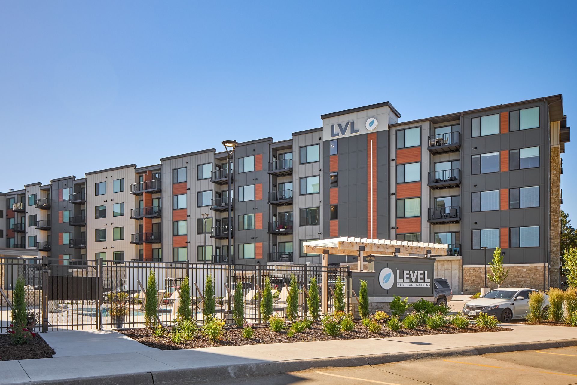 Modern apartment building with a sign that reads 