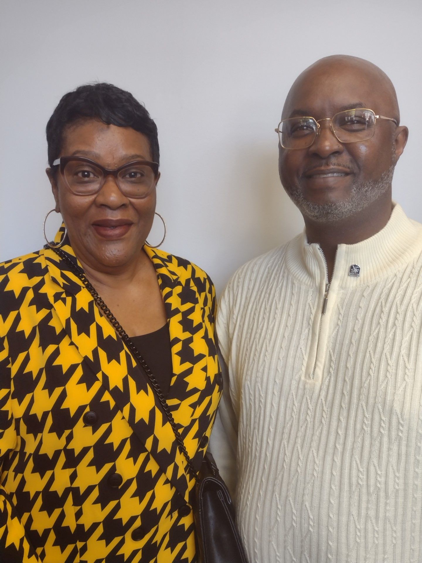 A man and a woman are posing for a picture together.