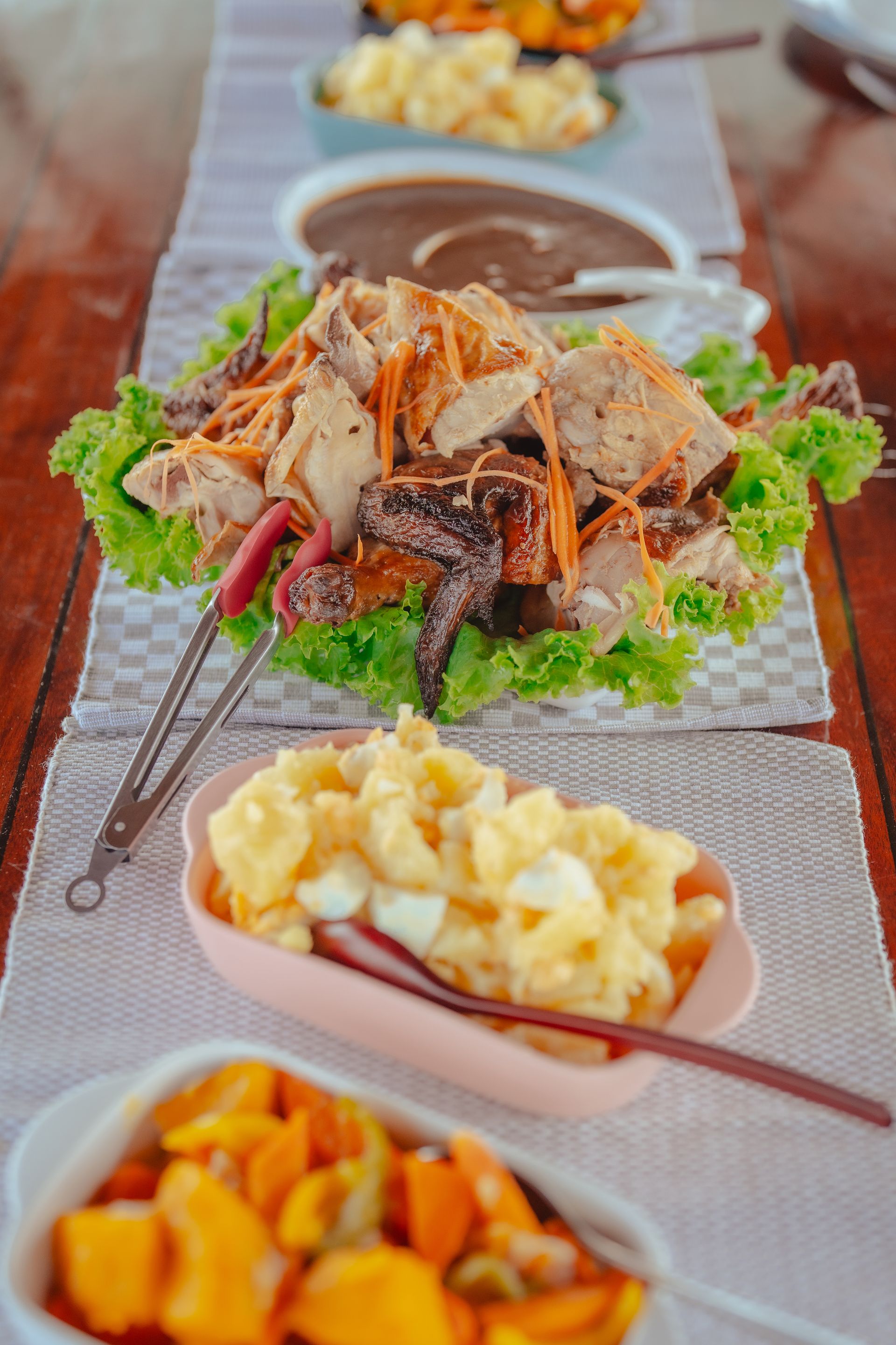 There are many different types of food on the table, in the boat. 