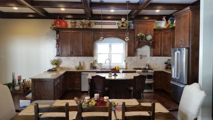 A kitchen with a table and chairs in it