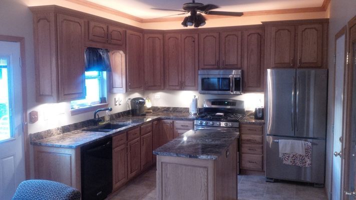 Cabinets surround the kitchen