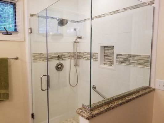 Walk in shower with a glass door