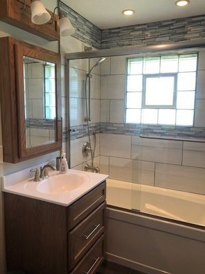 Bathroom sink beside shower