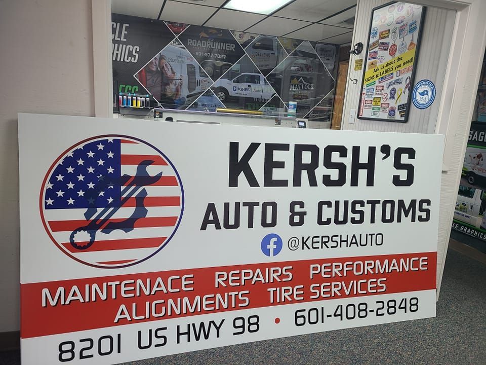 A business sign for Kersh’s Auto & Customs at 8201 US Hwy 98, listing services and phone number 601-408-2848.