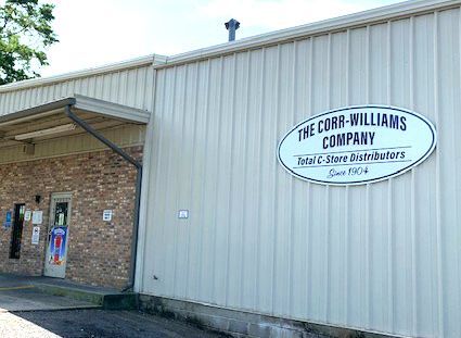The Cobb-Williams Company warehouse exterior with a sign reading "Total C-Store Distributors Since 1904."