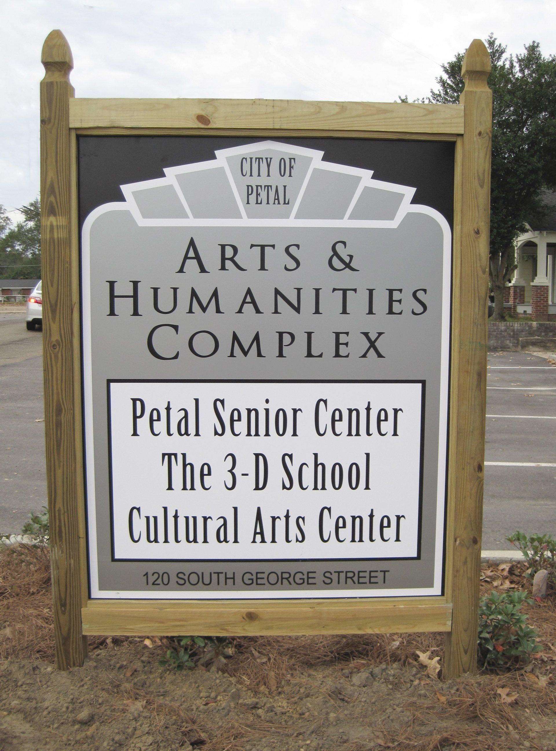 A sign for the City of Petal Arts & Humanities Complex at 120 South George Street, listing its tenants.