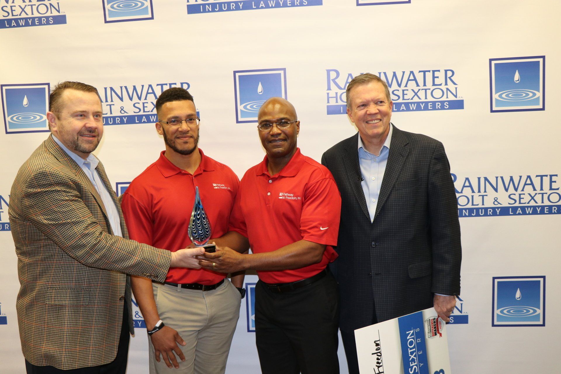 PTF members accepting award from Rainwater, Holt, & Sexton