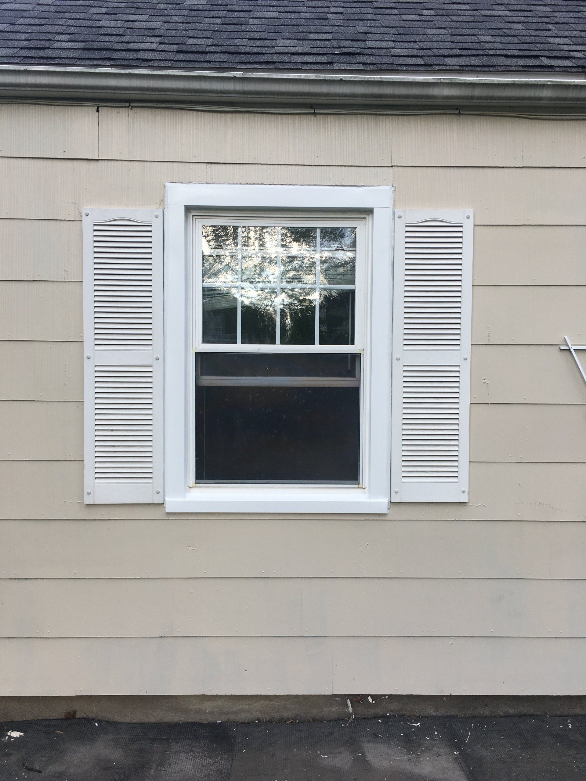 window with white shutters